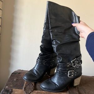 Black strappy heeled boots